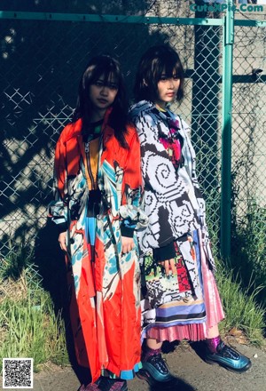 A woman wearing a colorful dress and a backpack.